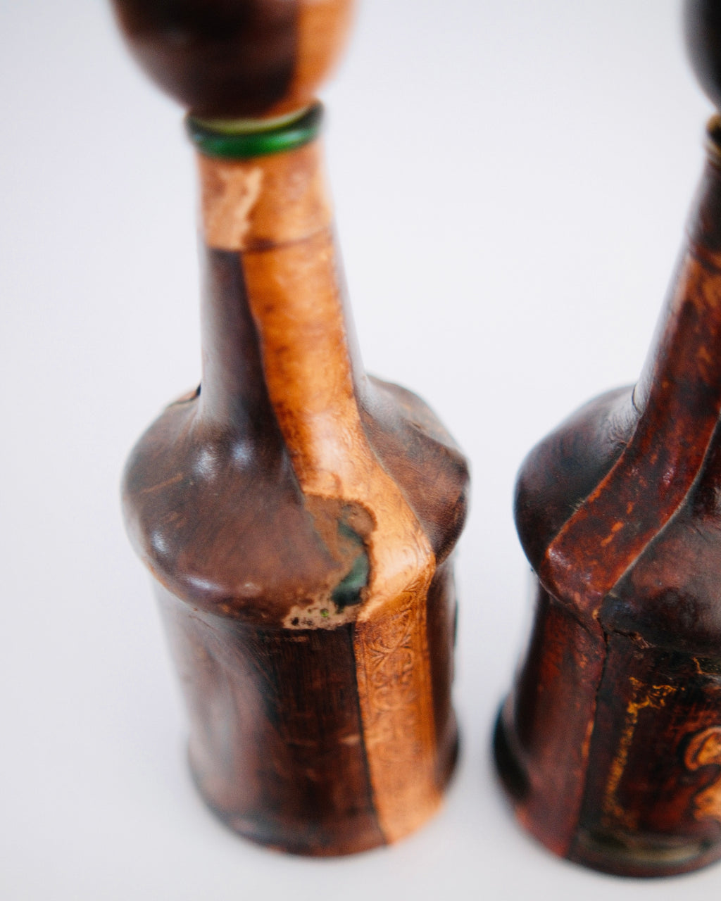 The Medici Pair | Mid-Century Italian Leather-Wrapped Decanters with Embossed Lion Crests