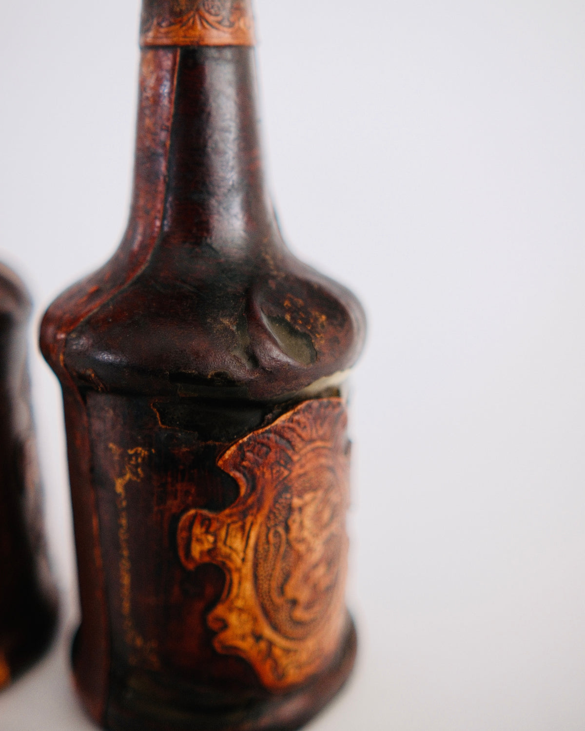 The Medici Pair | Mid-Century Italian Leather-Wrapped Decanters with Embossed Lion Crests