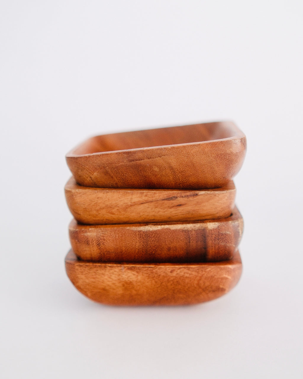 Stacked set of four vintage mid-century square hand-carved monkeypod wooden snack bowls - Eulogy Vintage